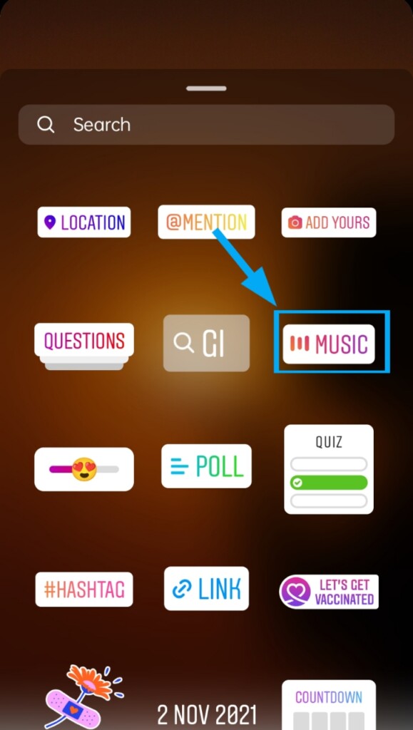 Scroll and find the 'Music' sticker or you can simply search it then tap on it.